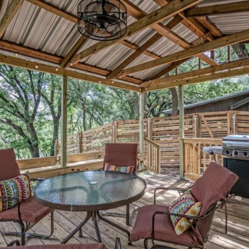 Covered deck area has a gas grill complete with propane and grilling utensils.  Complete with comfortable seating for morning coffee or evenings to grill steaks, have a glass of wine with friends, play games or relax.